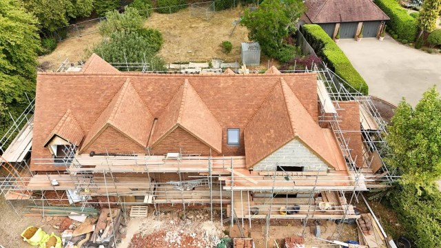 New roof using hand made clay roof tiles