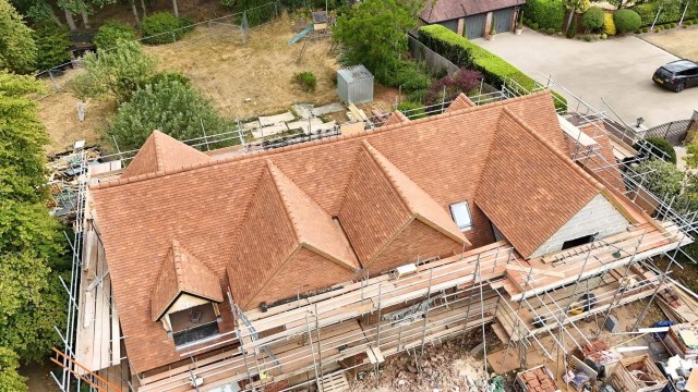 New roof installation using handmade clay roof tiles